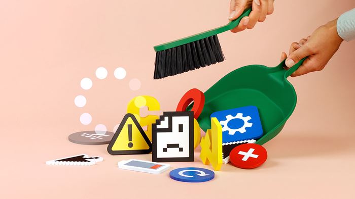 En sop och sopar upp olika symboler för it-problem i en skyffel